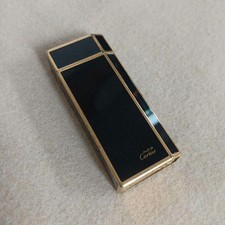 must de Cartier Lighter body gold black swiss