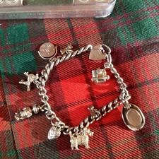 Silver Charm Bracelet With 9 Silver/White Metal Charms 44 gms CB 15
