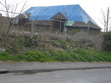 Photo A1 Mersham Courtu00e2u0080u0099s derelict barn Seen from Church c2015