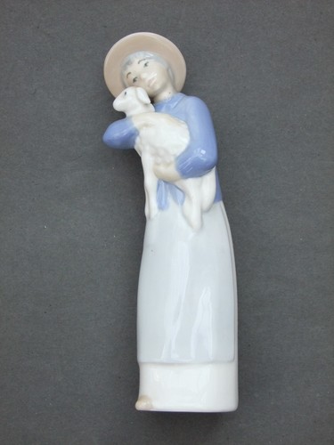 Girl holding lamb rex - a,