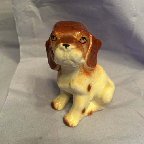 Brown and beige pottery dog - and,