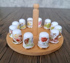 Vintage Caverswall Thimbles 12 Months on a holder.