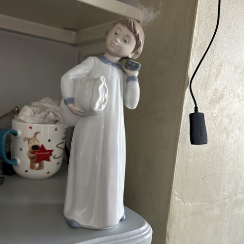 Lladro nao figurine off bed - nao,