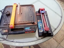 Tile Cutter. Diamond Wet Wheel Electric Working Condition With Hand Cutter Tool