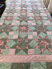 Antique king sized quilt with pink and green