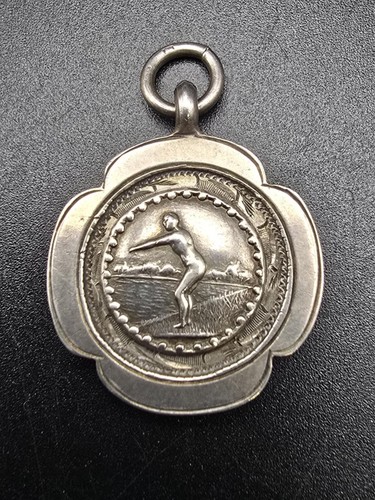 Silver watch fob swimming