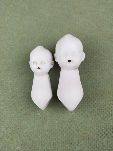 Two antique dollhouse baby