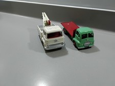 Two Atlas editions di- cast model British classic era trucks