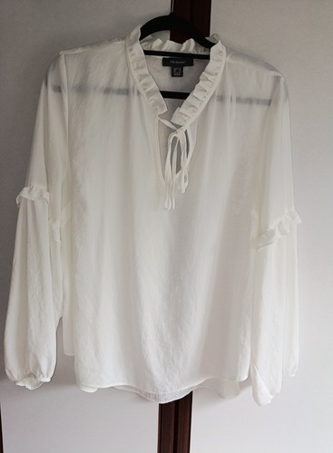 White blouse features - , a