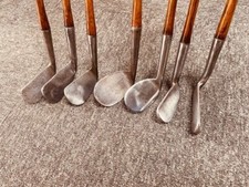 antique vintage hickory wood shaft golf clubs -six irons and a Stewart putter
