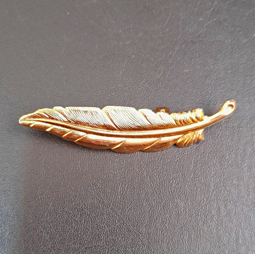 Gold tone metal feather brooch - metal,