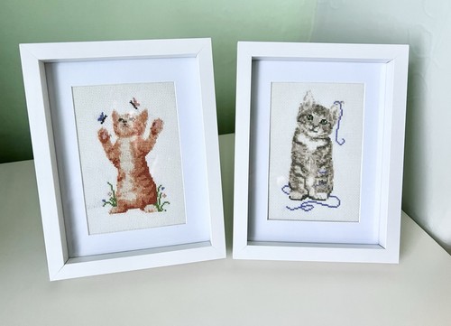 Two embroidered cross-stitch