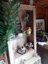 TALL SHELVING UNIT WITH DRAWERS, SHELVES AND LIGHT, MATCHING GLASS COFFEE TABLE