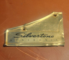 VINTAGE SILVERTONE TIN BADGE