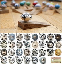 Ceramic door knob on wooden door stop.Choose your design. Black white patterned.