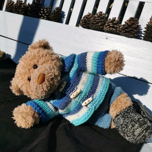 Hand knitted teddy bear