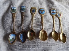 Job lot of 6 x GOLD PLATED SOUVENIR TEA SPOONS ..different badges