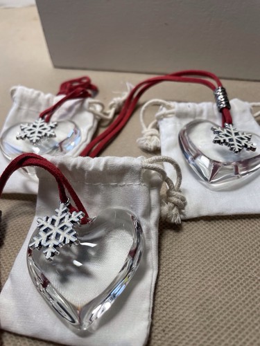Three glass hearts with - three,