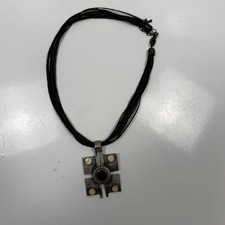 Costume jewelry necklace stringed and metal pendant