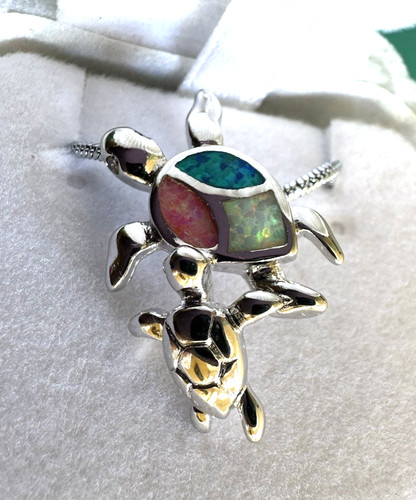 Sea turtle pendant featuring