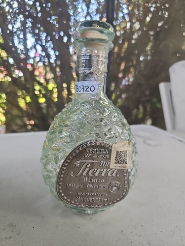 Empty tequila bottle - tequila,
