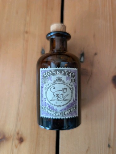 Empty monkey gin bottle - gin,