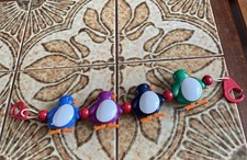 Vintage Coach Built Pram Buggy Elasticated Toy Colourful Penguins Rattle