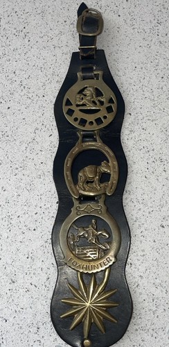 Horse brasses a black - on,