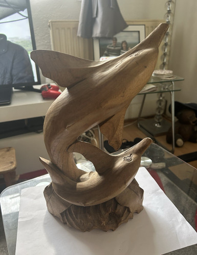 Hand carved wooden dolphin - hand,