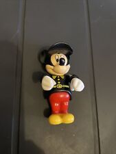 MICKEY MOUSE SMALL FIGURE WITH RED TROUSERS AND BLACK FIREMANS UNIFORM ?