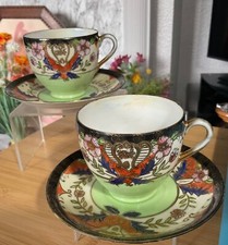 TWO GENUINE SAMURAI JAPANESE FINE CHINA CUPS AND SAUCERS