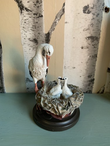Stork with babies - , in