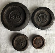 Set of FOUR Old Cast Iron Weights with Prominent Assay Marks.