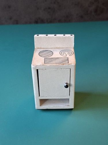 Vintage dolls house - dolls, cooker