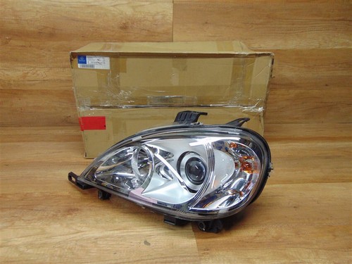 Left headlight genuine - left,