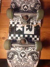 Airwalk skateboard trucks, with green wheels and bearings