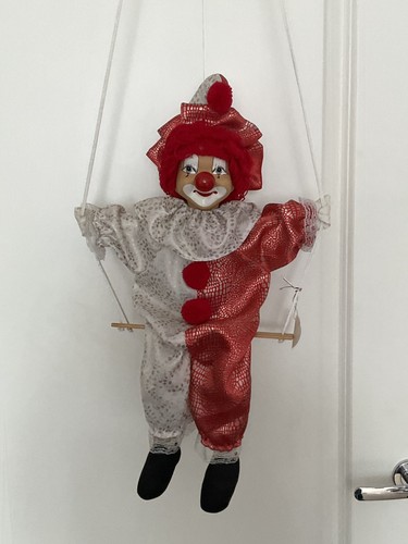 Porcelain faced clown doll - faced, on