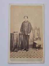 CDV OF MAN BETWEEN TABLE & A