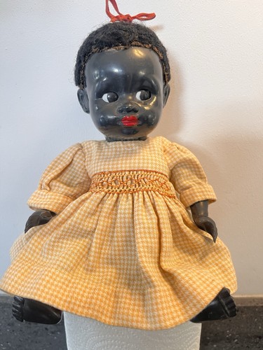 Antique black doll from 1950s - antique,