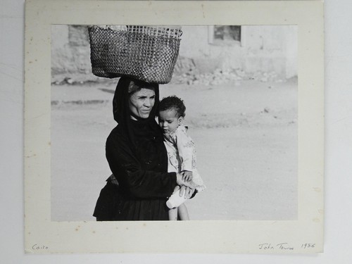 Woman carrying woven basket - woven,