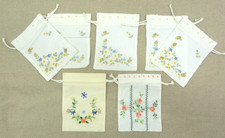 Embroidered draw string bags x 7  6 x 8 ins 3 patterns of flowers