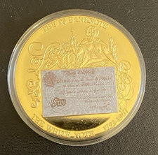Gold plated coin featuring