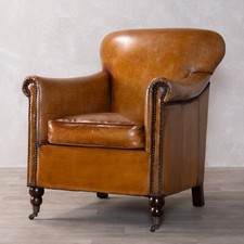 TAN LEATHER ARMCHAIR