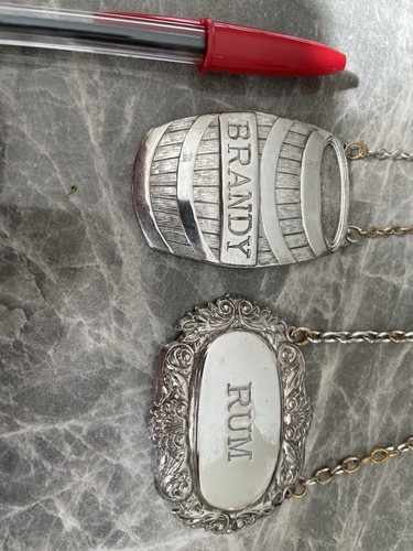 Two silver plate bottle labels - two,
