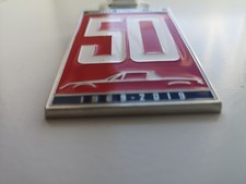 Anniversary grill badge emblem