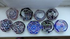 Limited edition Whitefriars paperweights. Nine in total.