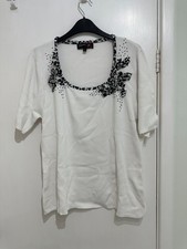 Ladies white top by Stephen Y size L/XL.Black and white animal print at neck.