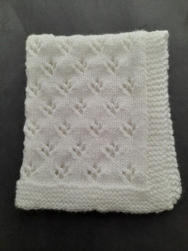 Hand knitted dolls pram cot - hand,