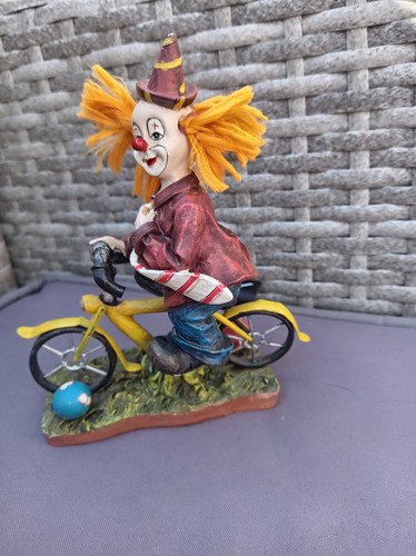 Vintage clown riding bike - vintage,