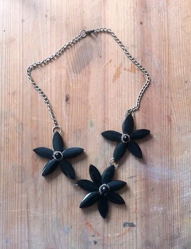 Repaired black flower